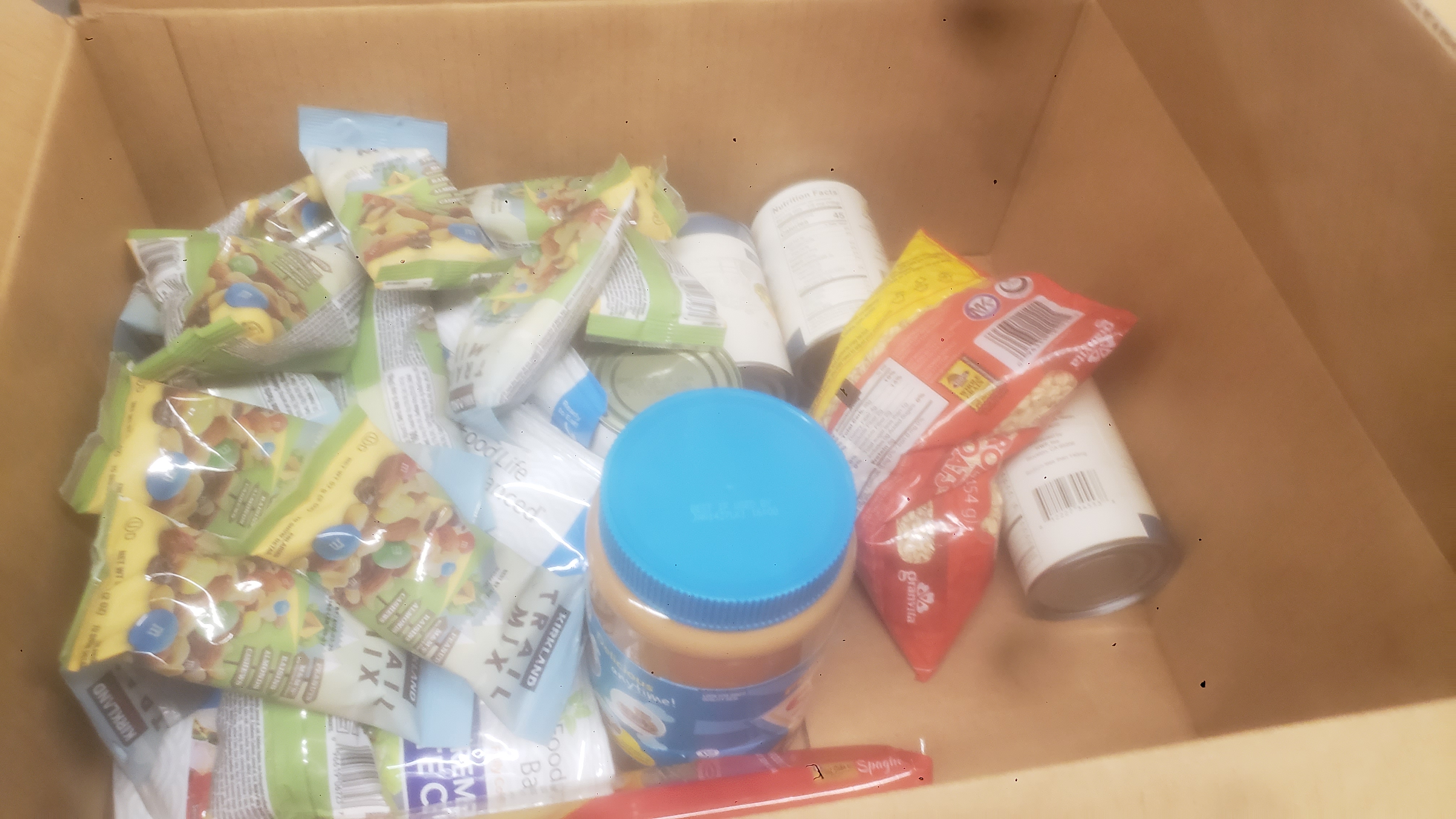 Cardboard box filled with dry goods.